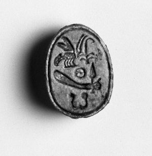 Not the actual scarab in the story. Scarab of Amunhotep I. Steatite, glazed, 7/16 x 11/16 in. (1.1 x 1.8 cm). Brooklyn Museum, Charles Edwin Wilbour Fund, 44.123.142. Creative Commons-BY-NC.